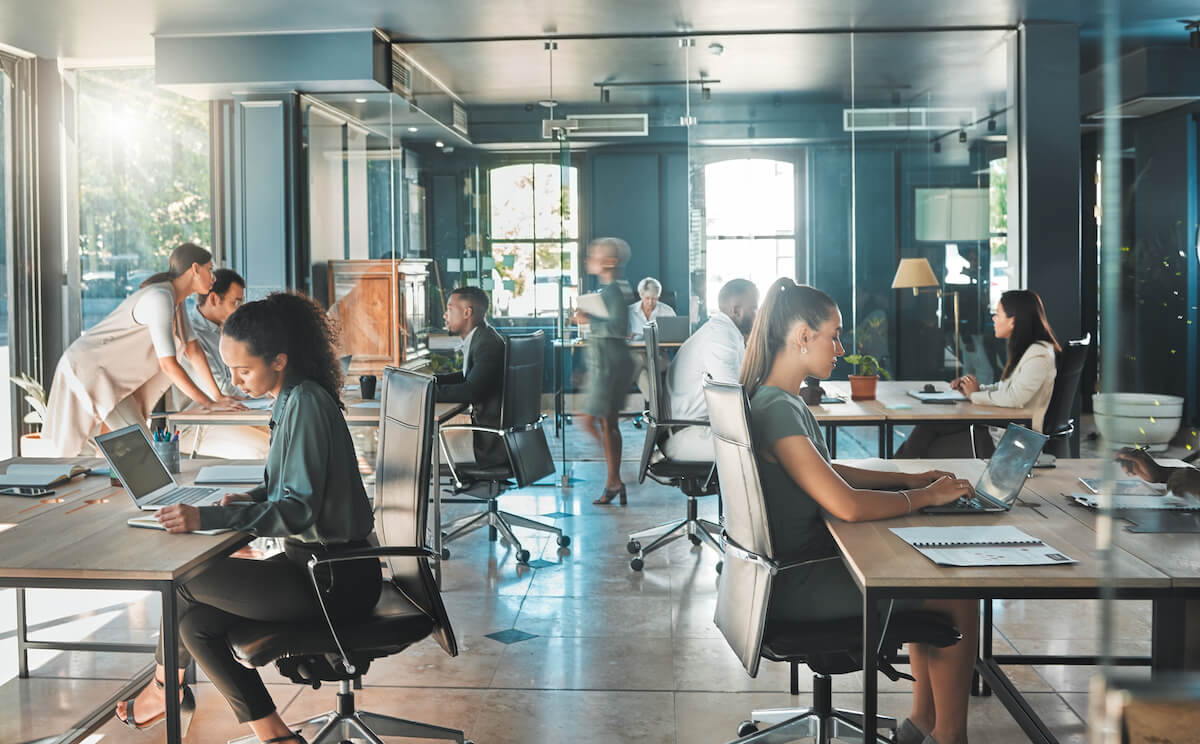 Photo of employees in a bustling office